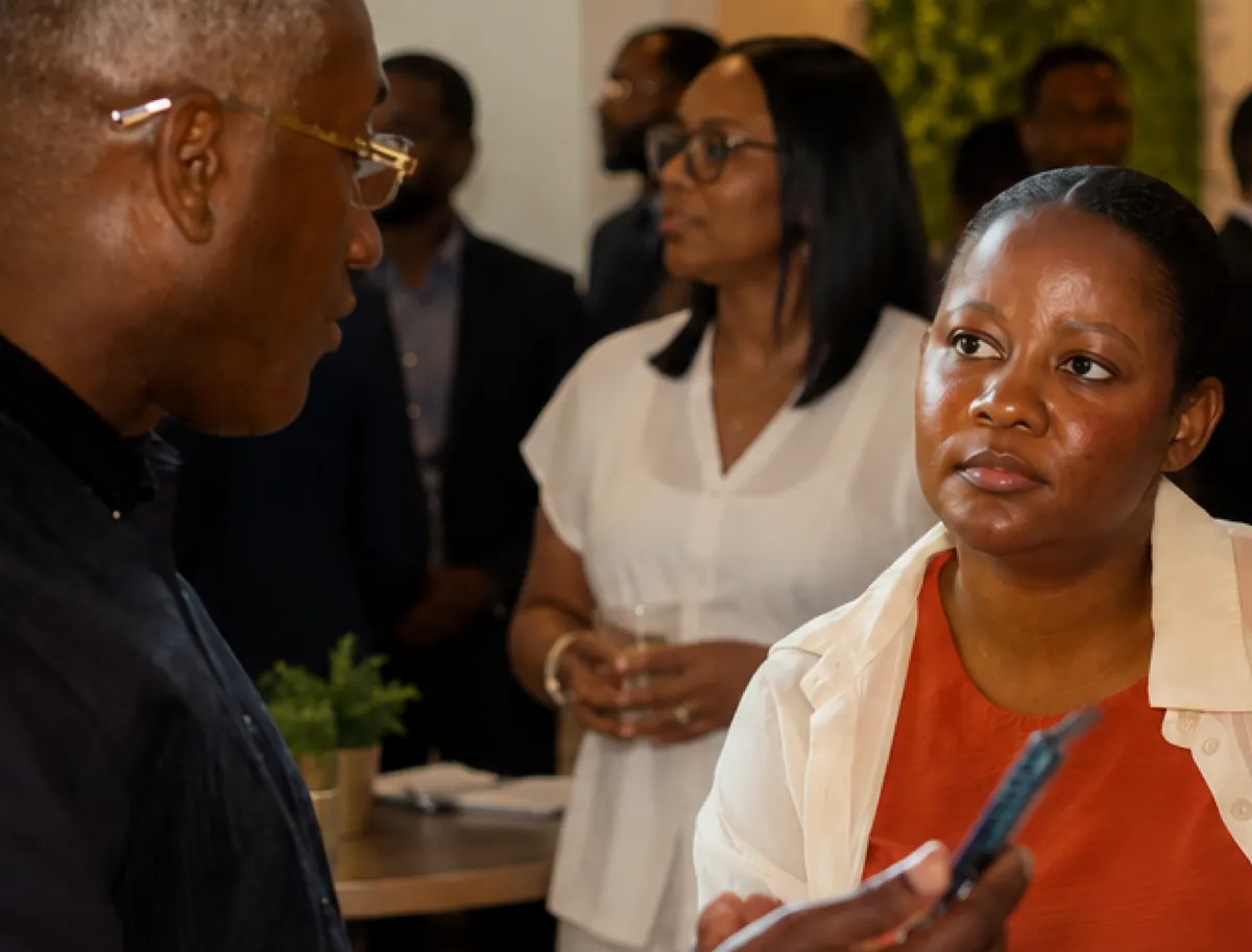Guests in conversation at the LYS & Co. Plas Piblik Meet and Greet networking event at Farm Fresh in Providence, Rhode Island